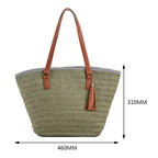 Green straw tote bag with brown straps and tassel, shown with measurements on a white background.