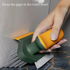 Cleaning tool with a brush and scrubber being used on a surface.