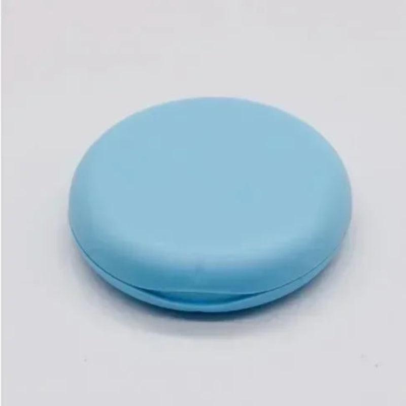 Round blue object on a light gray background