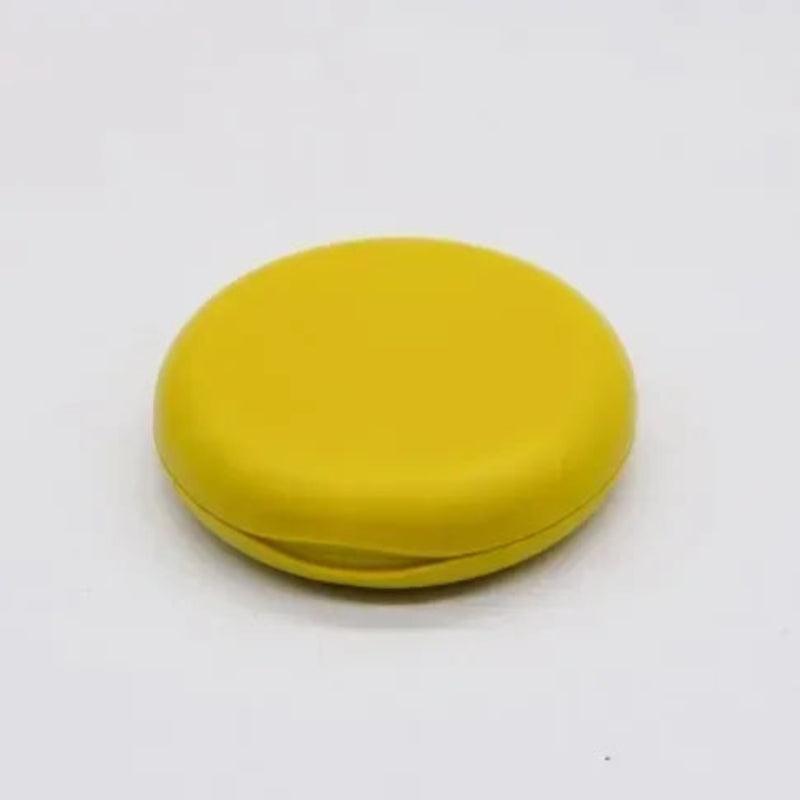 Yellow round object on a white background