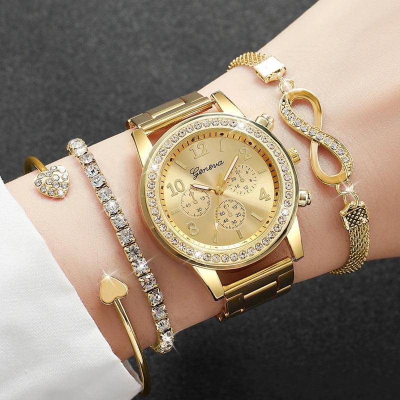 Gold wristwatch with matching bracelet on a wrist against a dark background