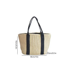 Woven bag with black straps and measurements on a white background
