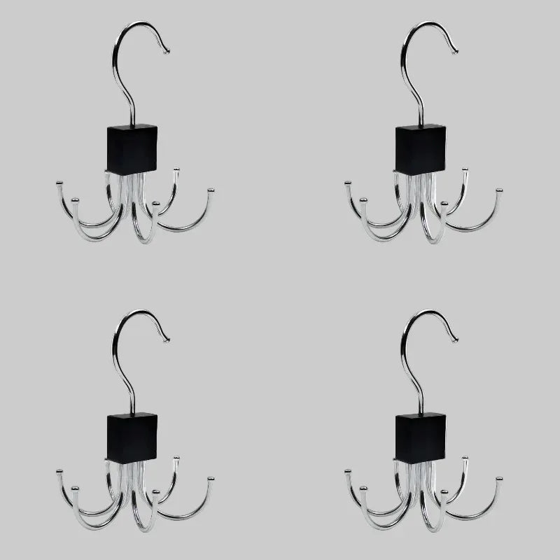Four metal hooks with black square pads on a white background
