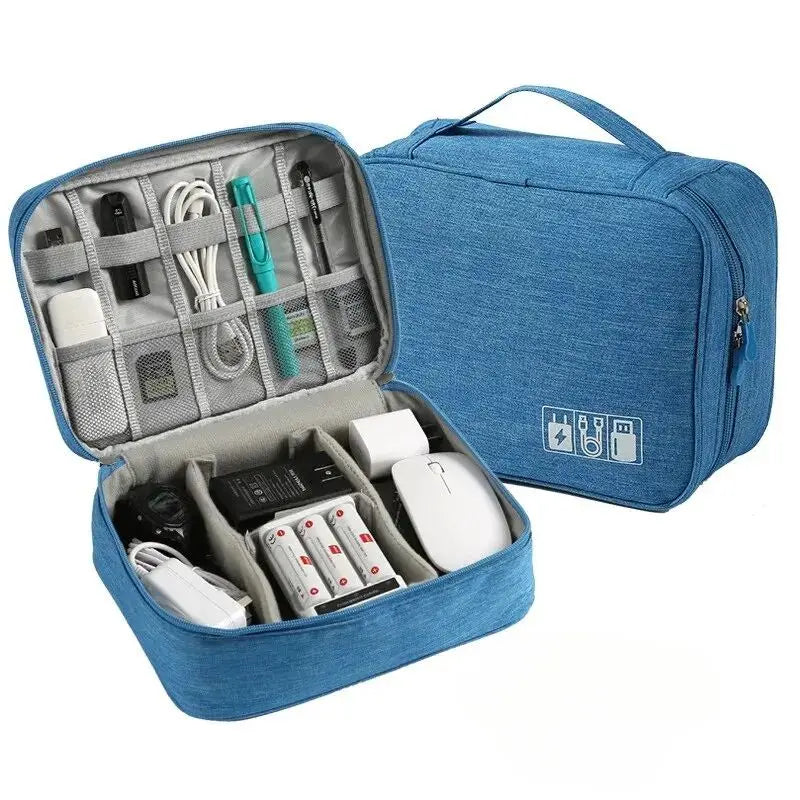 Blue travel organizer with electronic devices inside on a white background