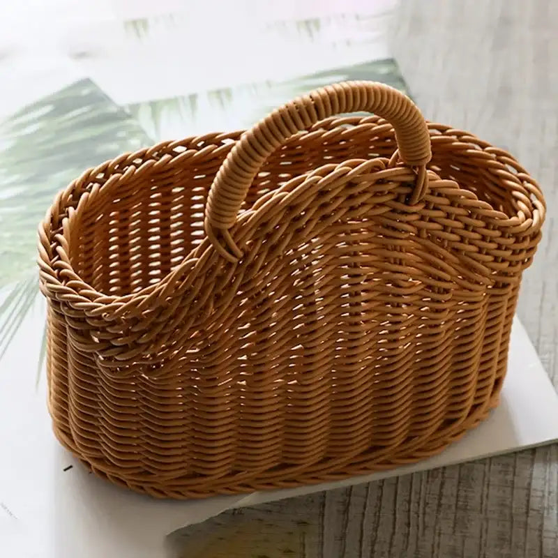 Wicker basket with a handle on a light surface