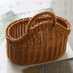 Wicker basket with a handle on a light surface