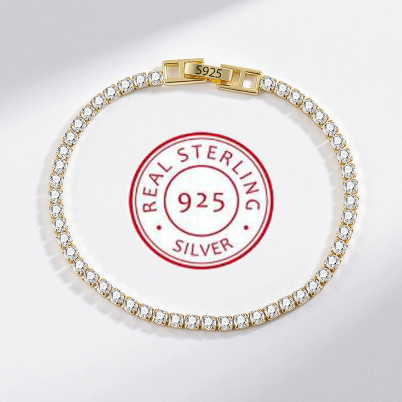 Gold bracelet with clear stones on a white background with 'Real Sterling Silver 925' stamp.