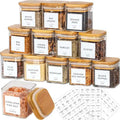 Set of spice jars with wooden lids and labeled labels on a white background