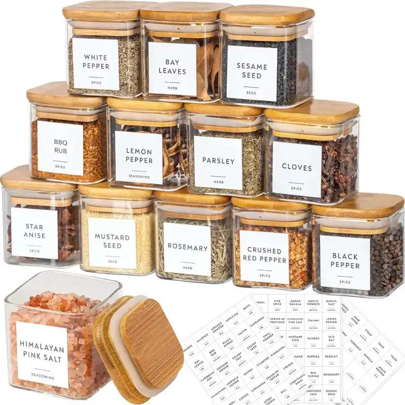 Set of spice jars with wooden lids and labeled labels on a white background