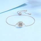 Silver bracelet with a diamond on a light blue background