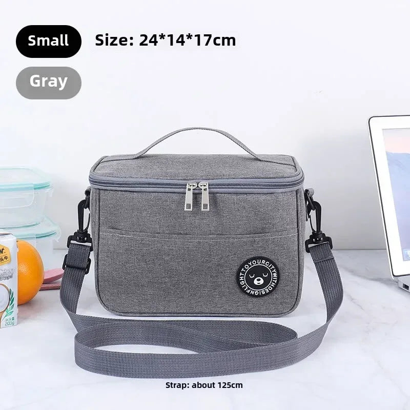 Gray cooler bag with strap on a white surface, size and color information displayed.