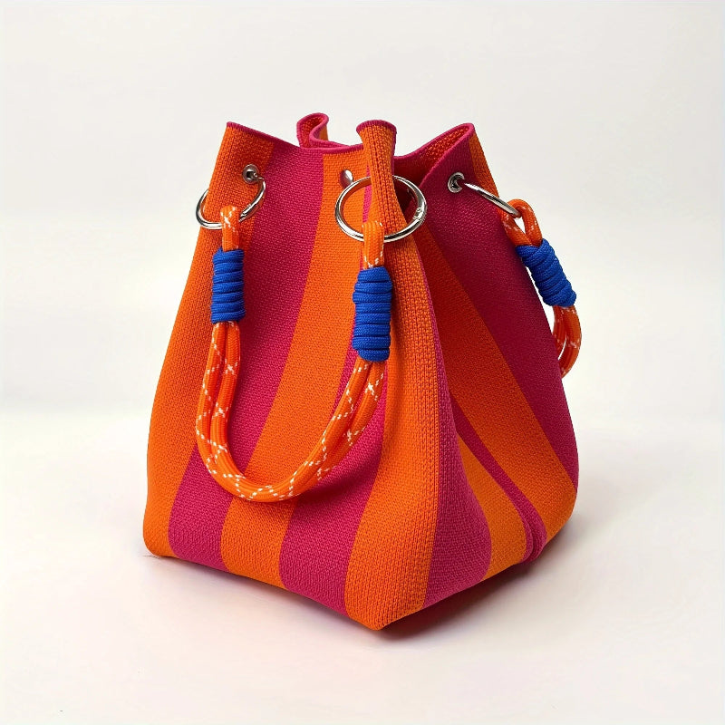 Colorful striped handbag with orange and pink stripes on a white background