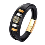 Black leather bracelet with gold and silver accents on a white background
