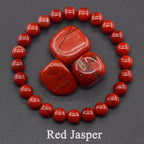 Red Jasper stones surrounded by red beads on a gray background