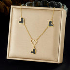 Necklace with heart-shaped pendants on a beige display box