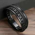 Black braided leather bracelet on a wooden surface