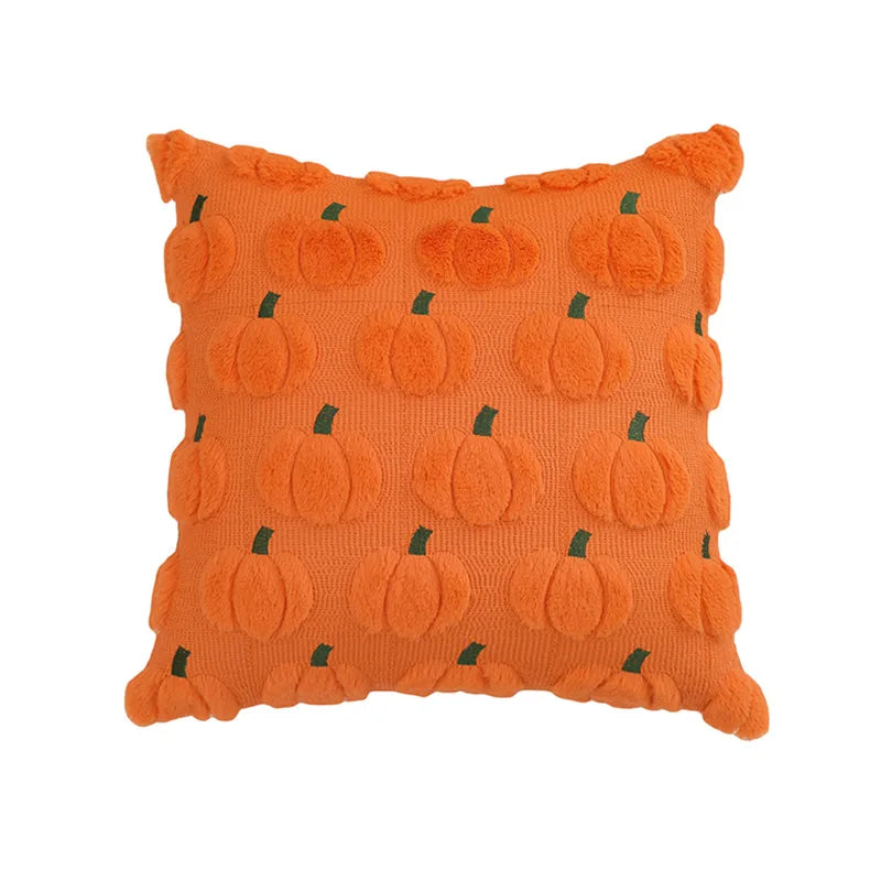 An orange textured throw pillow featuring a 3D pumpkin pattern with small green stems, set against a plain white background.