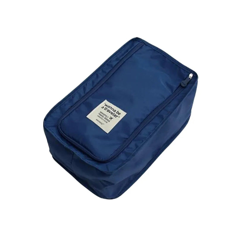 Blue travel toiletry bag with a label on a white background