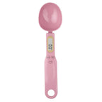 Pink digital measuring spoon on a white background