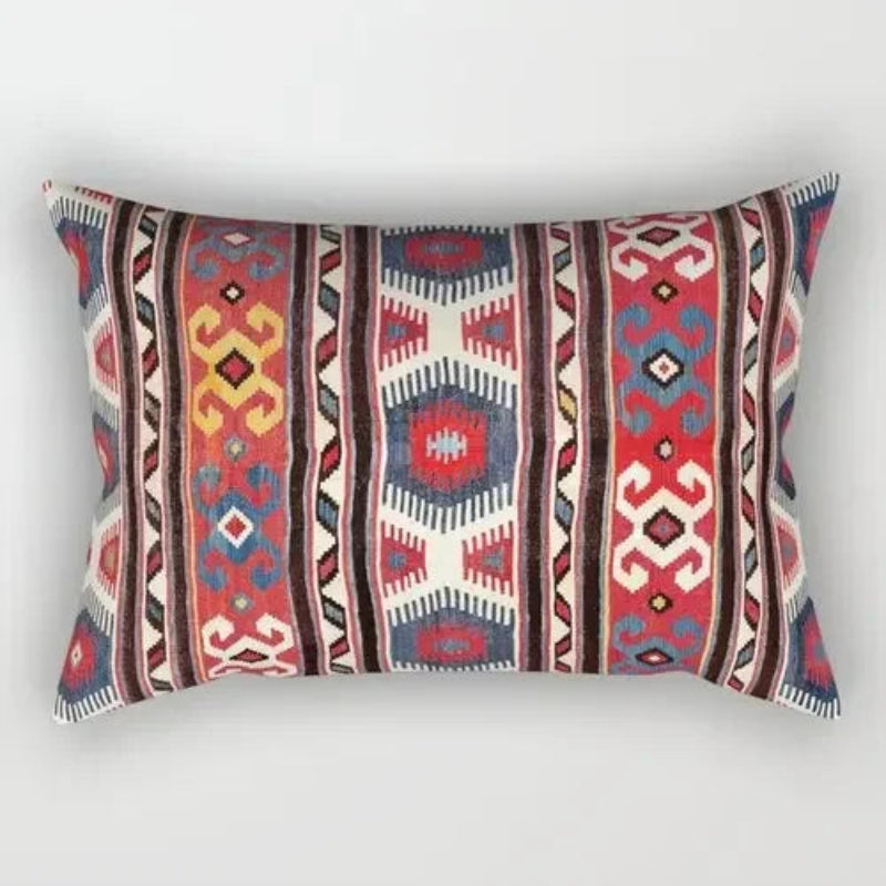 Decorative pillow with tribal pattern on a white background