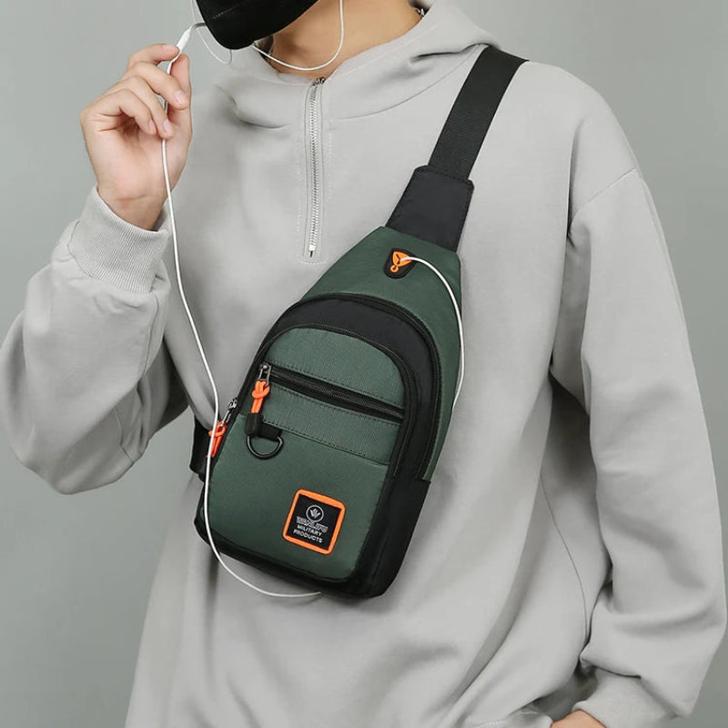 Person wearing a green and black sling bag with earphones, on a gray background