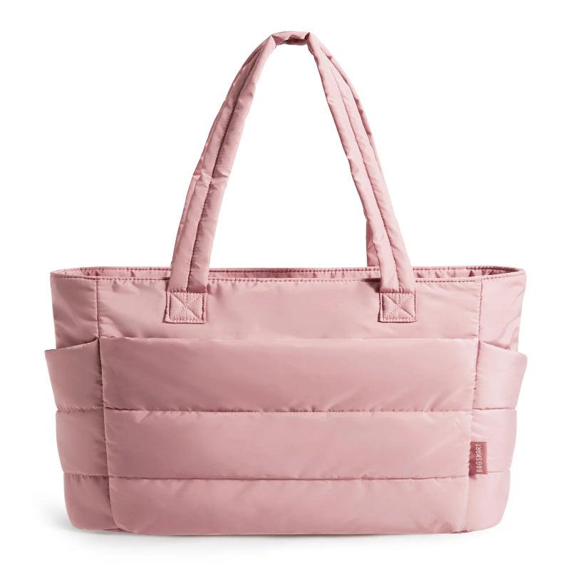 Dark pink tote bag with multiple compartments on a white background