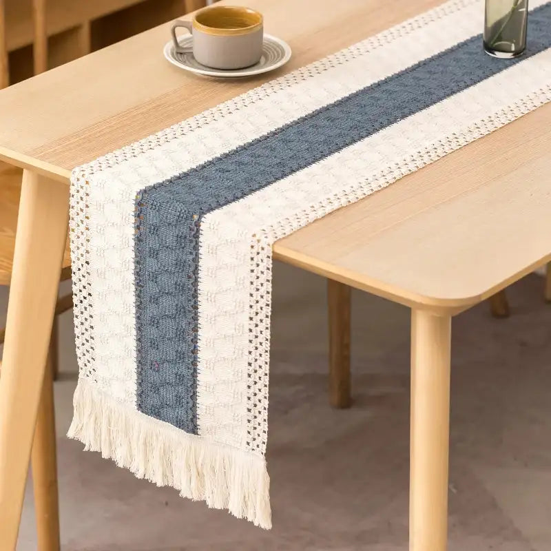 Table runner with blue and white stripes on a wooden table