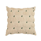 A square throw pillow in cream beige textured fabric with a raised pumpkin pattern and small dark green stems, shown on a plain white background.