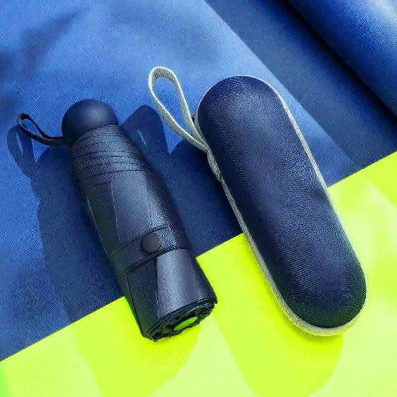 Blue umbrella and its case on a blue and yellow background