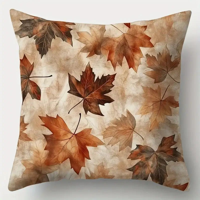 Pillow with autumn leaf pattern on a beige background