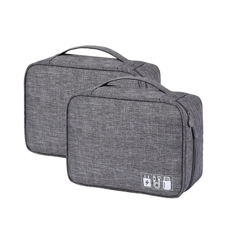 Two gray travel bags with USB charging ports on a white background