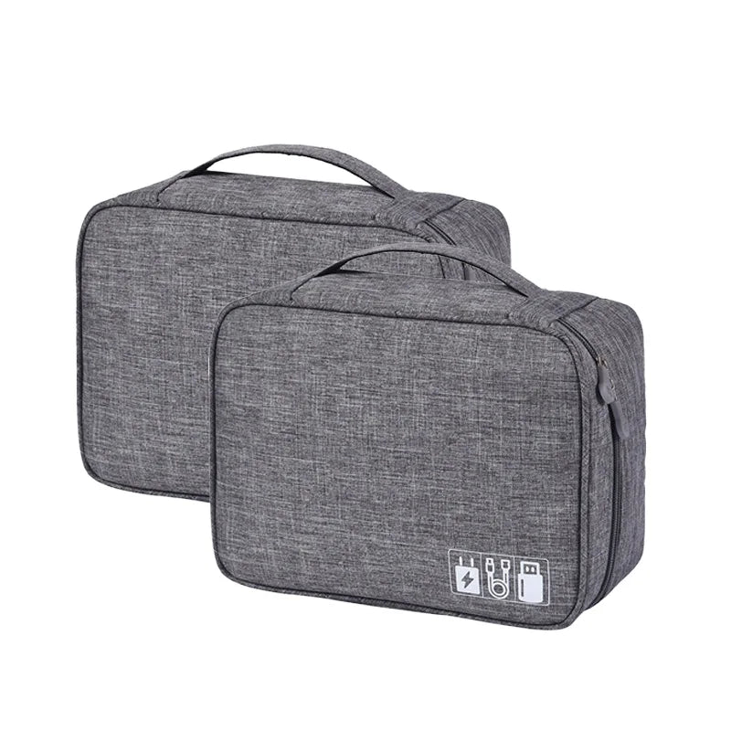 Two gray travel bags with USB charging ports on a white background