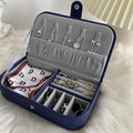 Jewelry organizer with necklaces, earrings, and a handkerchief on a white surface