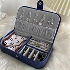Jewelry organizer with necklaces, earrings, and a handkerchief on a white surface