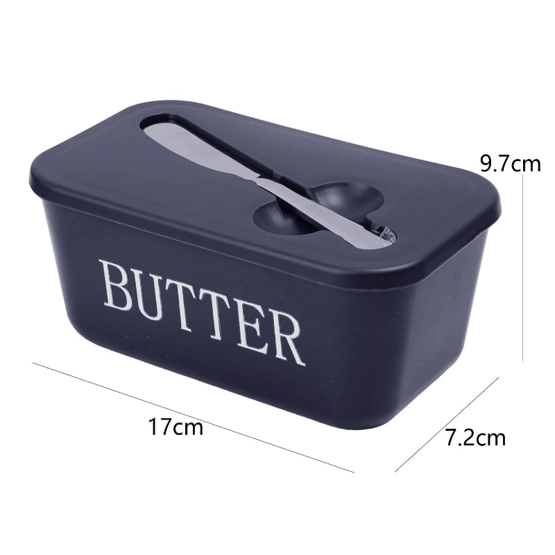 Navy blue butter container with a knife on a white background