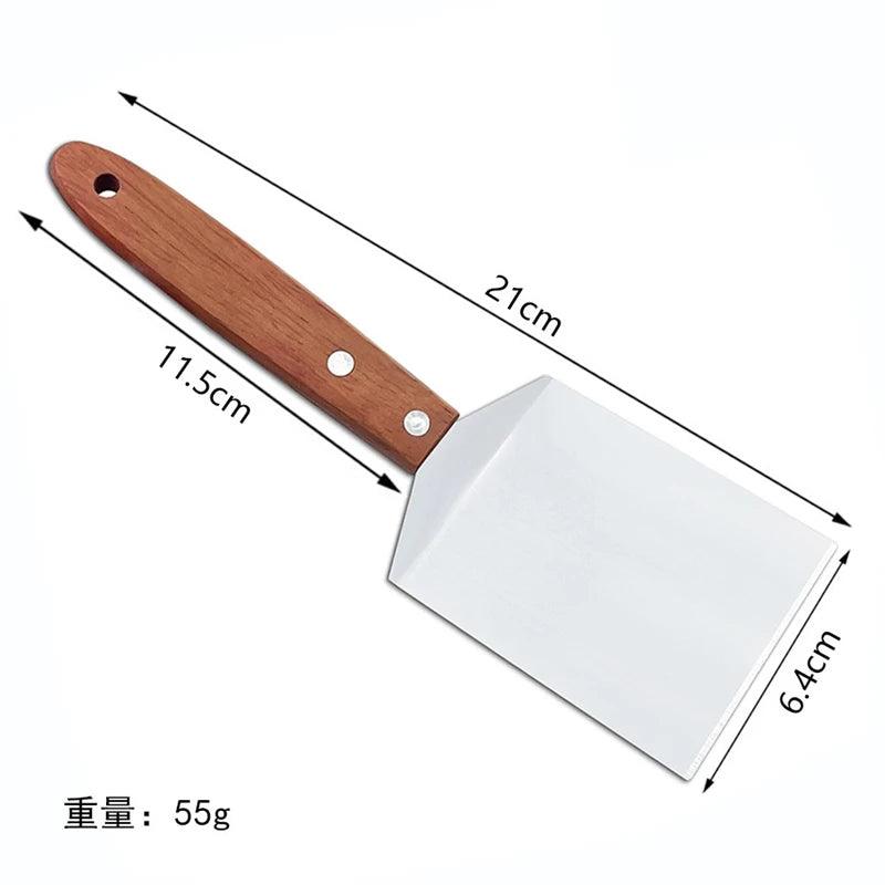 Measuring chart of a spatula with wooden handle and metal head on a white background
