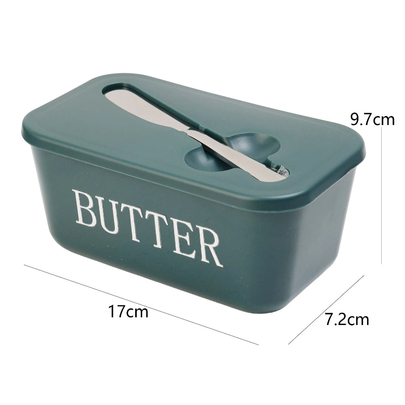 Green butter container with a knife inside, showing dimensions on a white background