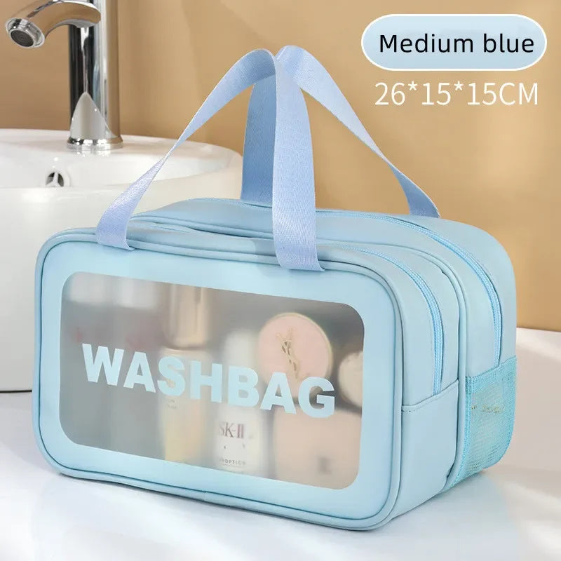 Light blue washbag with 'WASHBAG' text on a bathroom counter