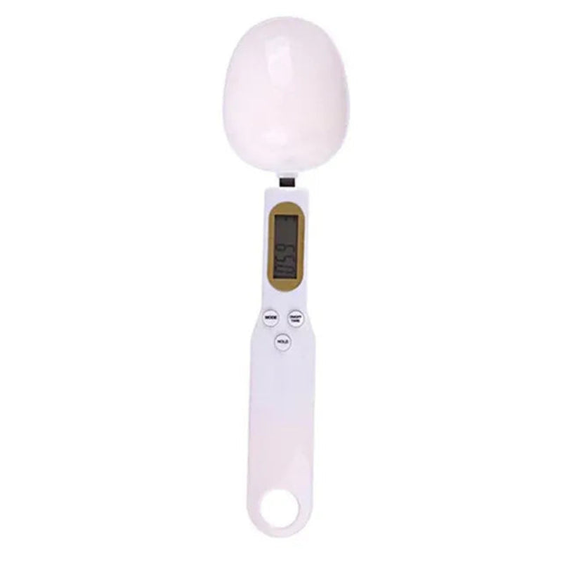 Digital kitchen scale with a white bowl on a white background