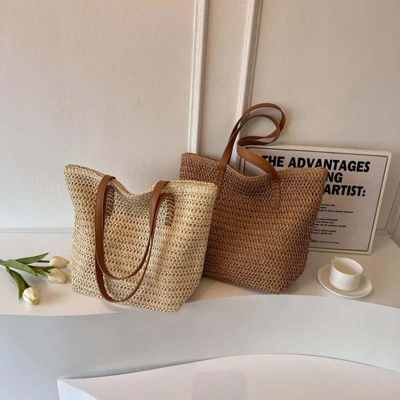 Two woven bags with brown handles on a white surface with a minimal background.