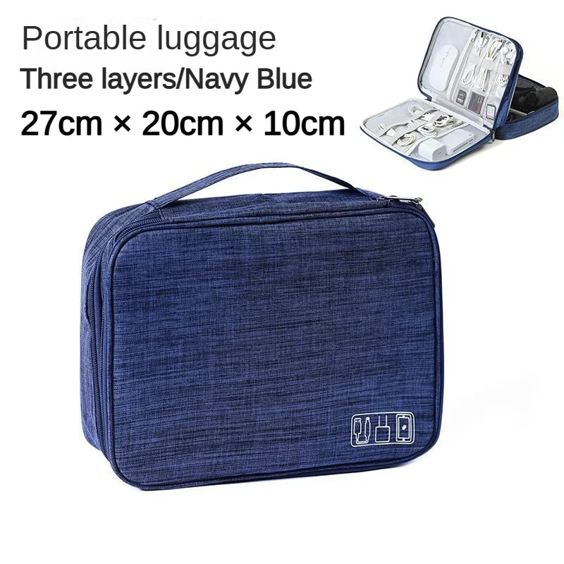 Navy blue portable luggage with open compartment showing items on a white background