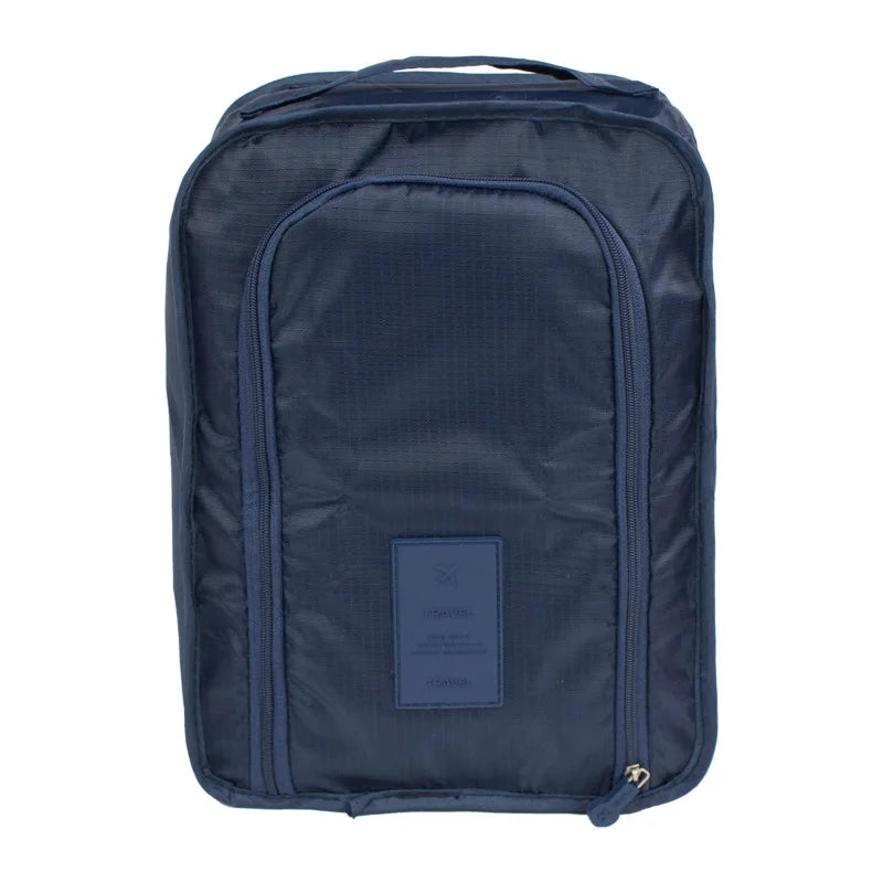 Navy blue backpack with a visible brand label on a white background