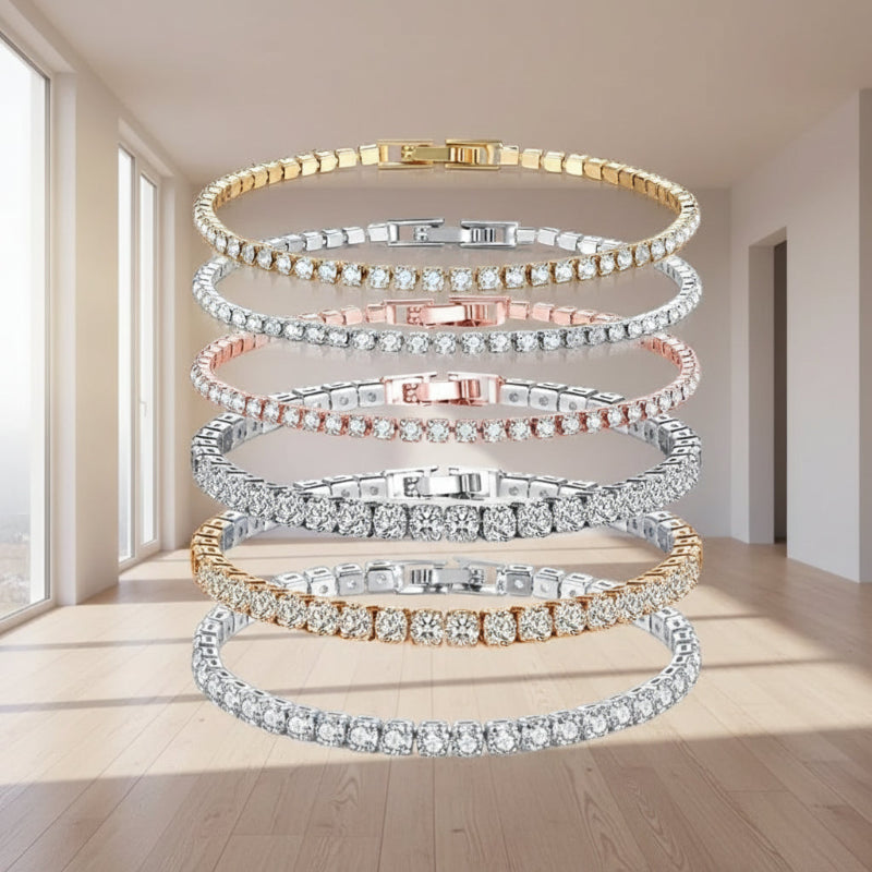 Five Andara tennis bracelets stacked vertically on a white background, featuring gold, silver, and rose gold metal settings with clear pavé stones. The Andara brand logo is visible in the top left corner.