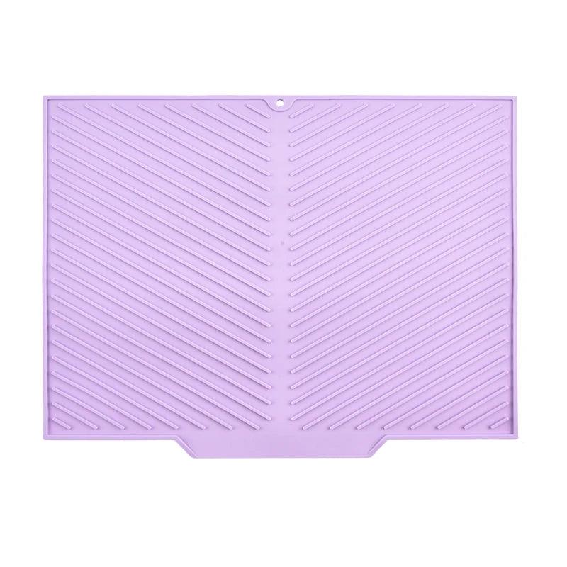 Purple silicone mat with textured pattern on a white background