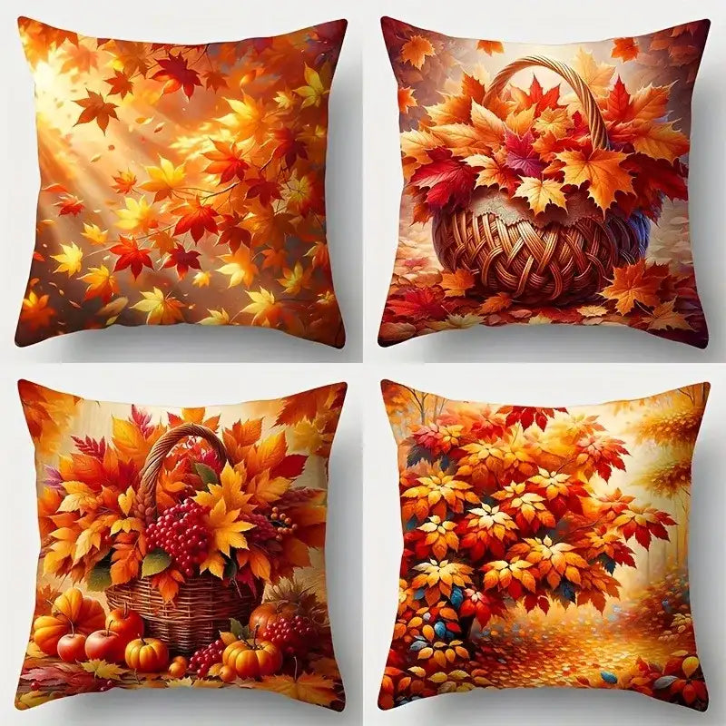 Four decorative pillows with autumn-themed designs featuring leaves, pumpkins, and a basket.