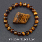 Yellow tiger eye bracelet with a piece of tiger eye stone on a dark gray background