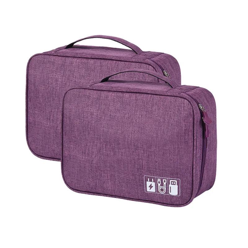 Two purple travel bags with a visible brand logo on a white background