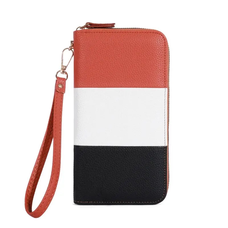 Color-blocked wallet with red, white, and black sections on a white background