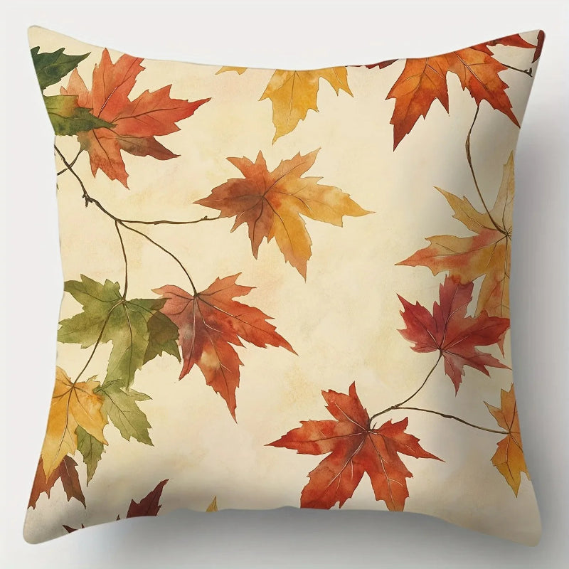 Pillow with autumn leaf pattern on a beige background