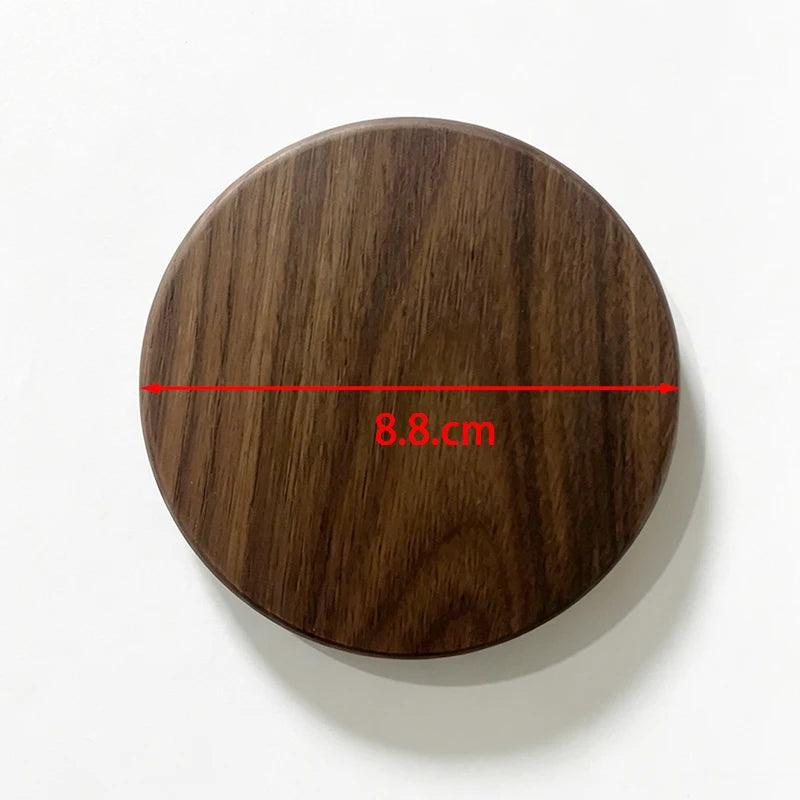 Round wooden coaster with measurement label on a white background